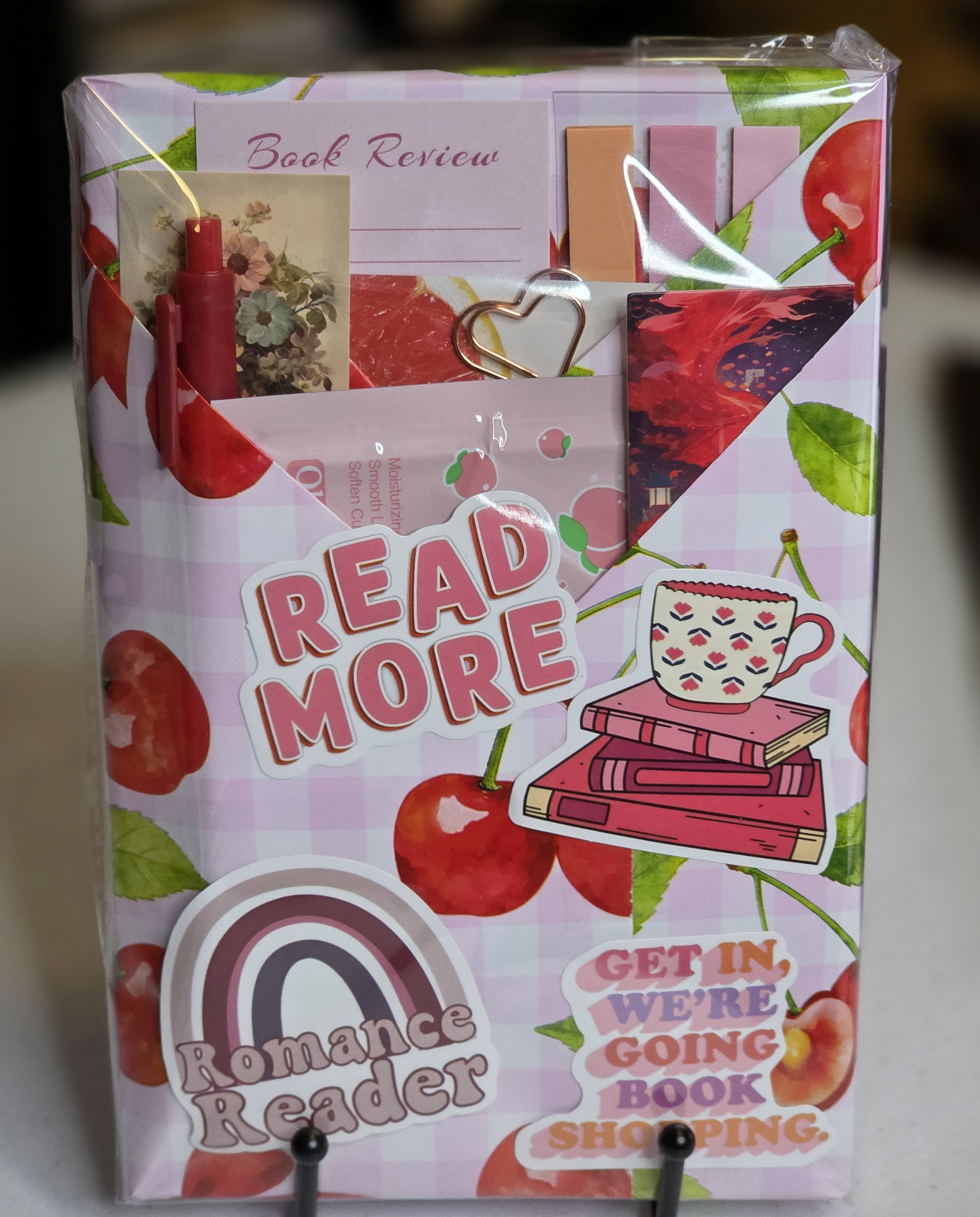 Date with a book package wrapped in cherry print with Read More and Romance Reader stickers